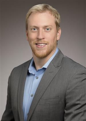 A professional photo of Jacob Covey