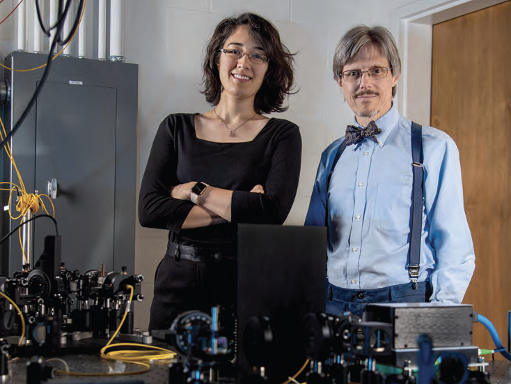 Virginia Lorenz and Paul Kwiat standing in a lab.